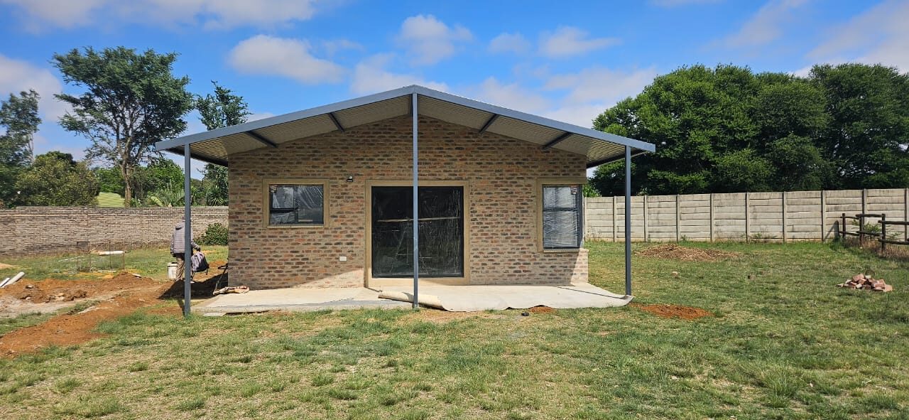 New brick home construction with steel roof