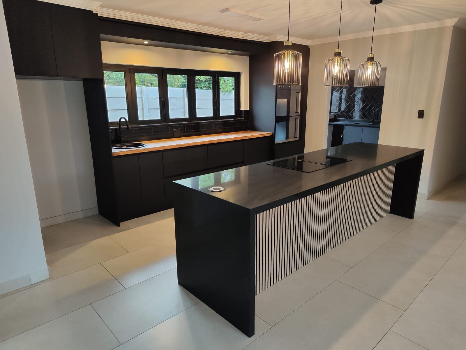 Signature black and timber kitchen island by Guest On Homes