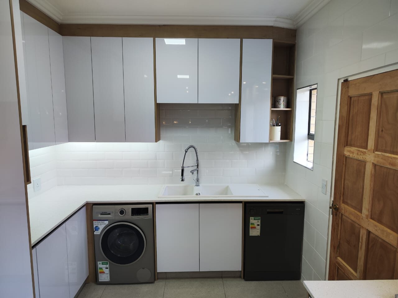 White scullery with laundry appliances